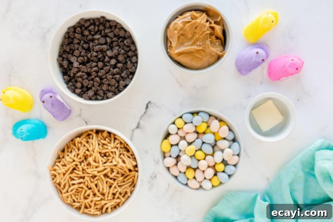 Nestled Treats 4 Collection of ingredients including chocolate chips, peanut butter, chow mein noodles, and candy eggs laid out for bird nest cookies.