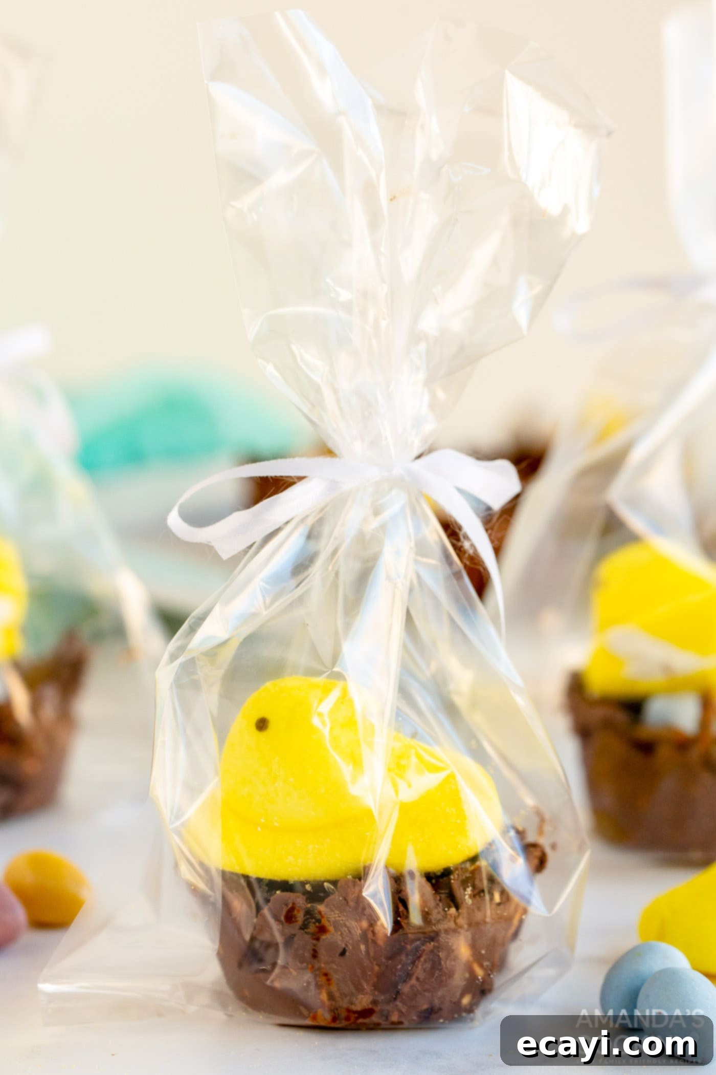 Nestled Treats 9 Finished bird nest cookies, one topped with a yellow Peep marshmallow, arranged on a serving plate.