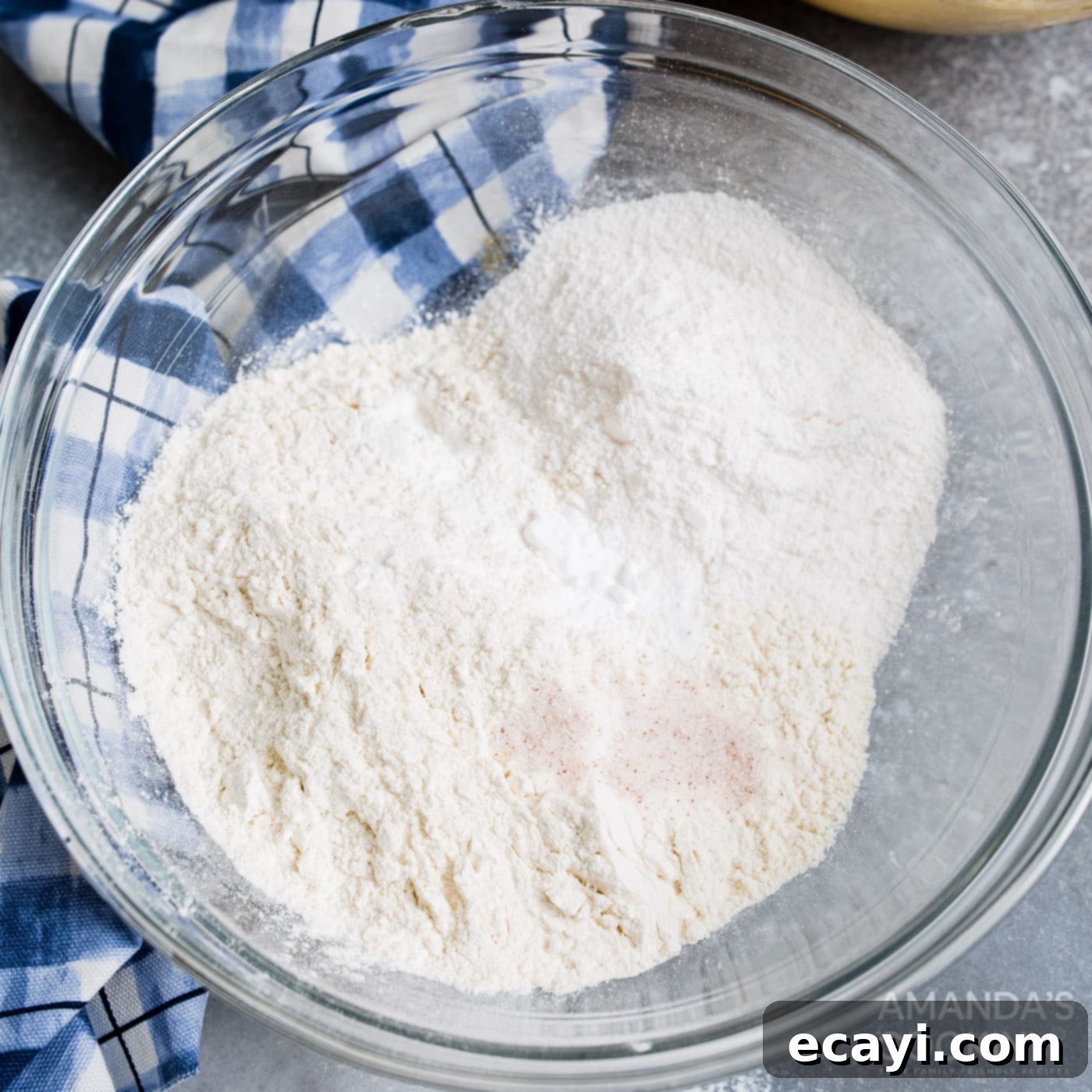 Your Air Fryer's Best Chocolate Chip Cookies 6 Dry ingredients for cookies (flour, baking soda, baking powder, salt, pudding mix) in a mixing bowl
