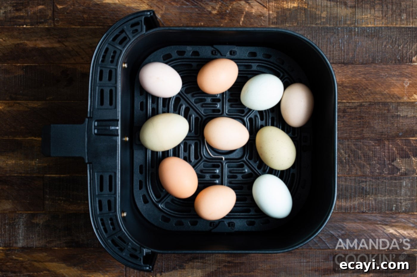 Hard Boiled Eggs in the Air Fryer 4 Eggs neatly arranged in an air fryer basket