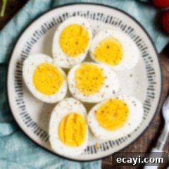 Hard Boiled Eggs in the Air Fryer 9 halved air fryer hard boiled eggs on a plate, showing perfect yolks