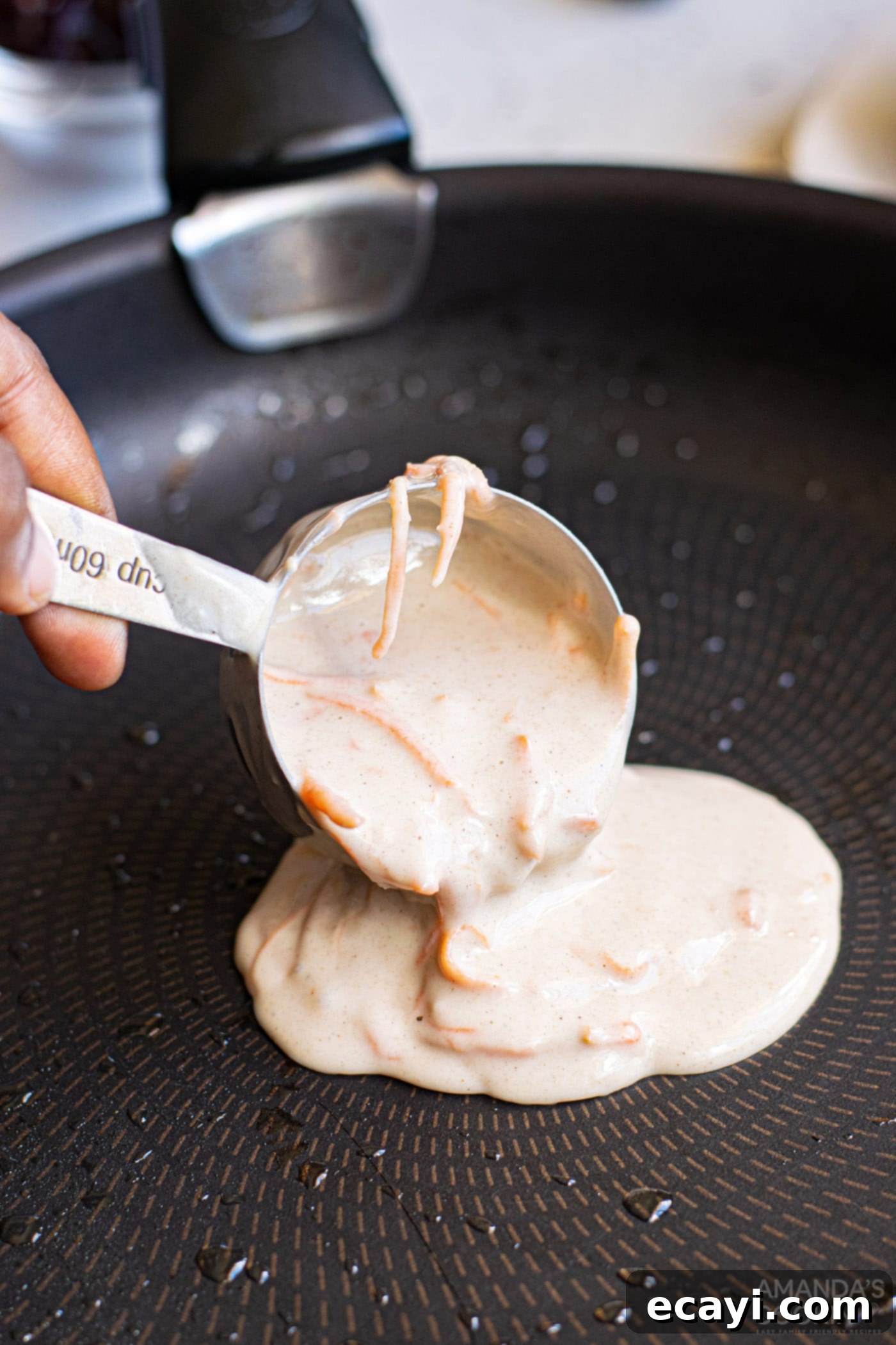 Morning Carrot Cake Bliss 6 pouring carrot cake pancake batter into a skillet