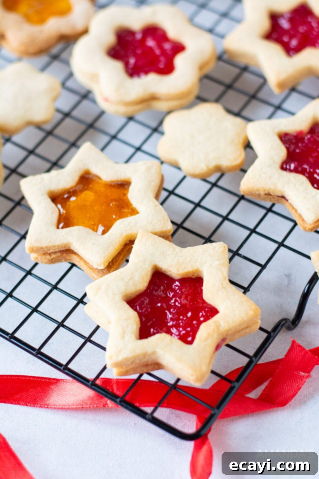 Linzer Jam Delights 3 linzer cookies on a wire rack