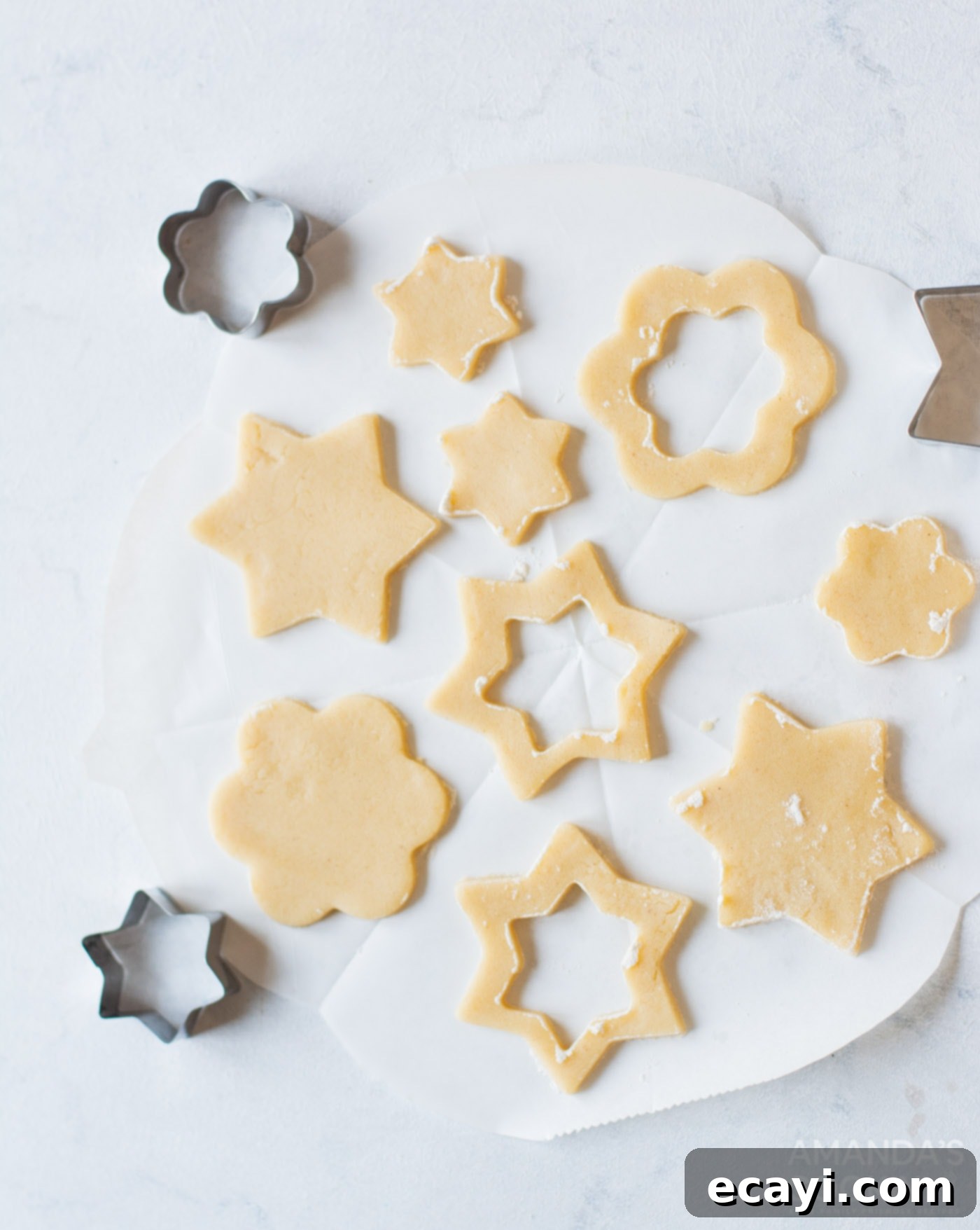 Linzer Jam Delights 8 cookie dough cut by cookie cutters into shapes