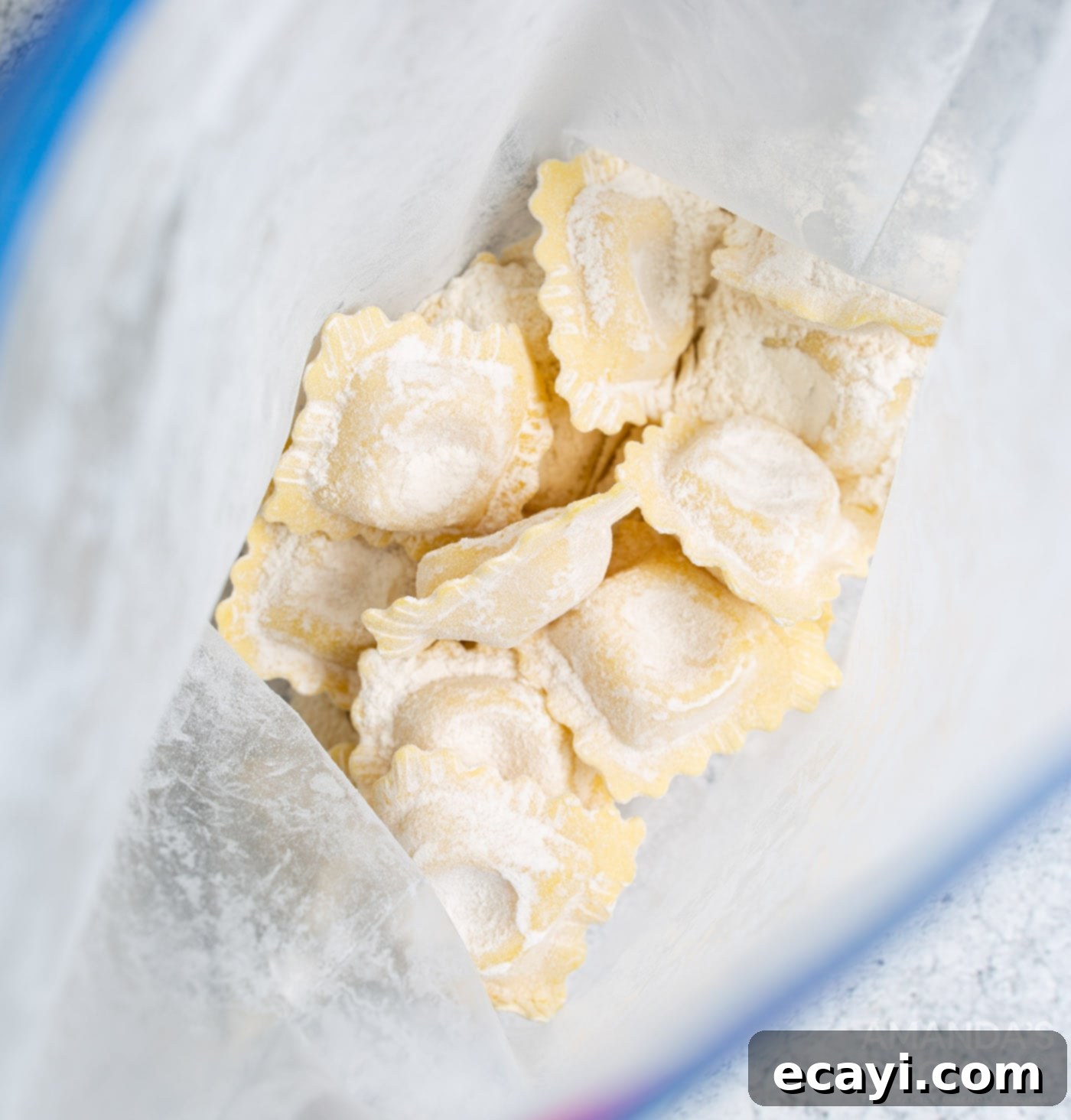 Crispy Air Fryer Ravioli 6 Ravioli being coated in flour inside a Ziploc bag