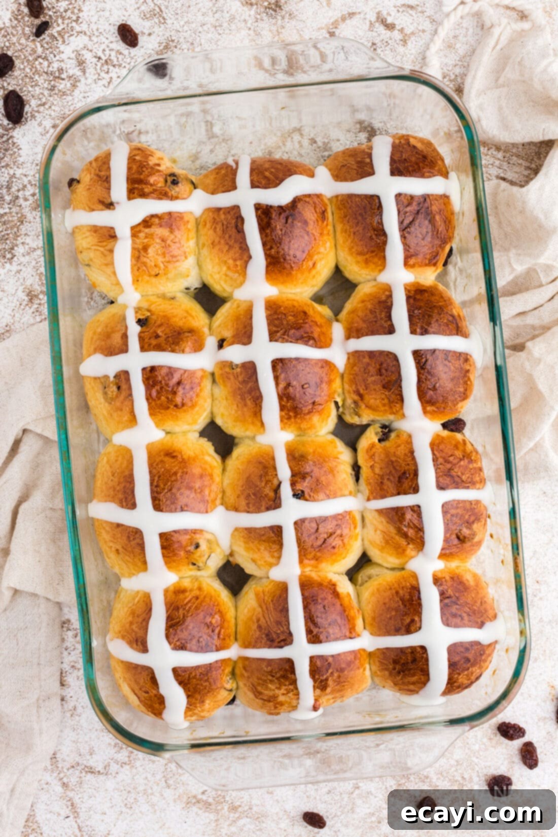 Spiced Easter Buns 3 A glass baking dish filled with golden-brown Hot Cross Buns, ready to be iced.