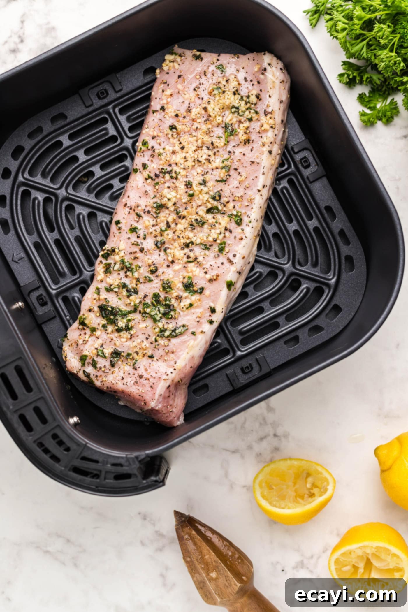 Air Fryer Pork Tenderloin Perfection 7 pork tenderloin meat on air fryer grate