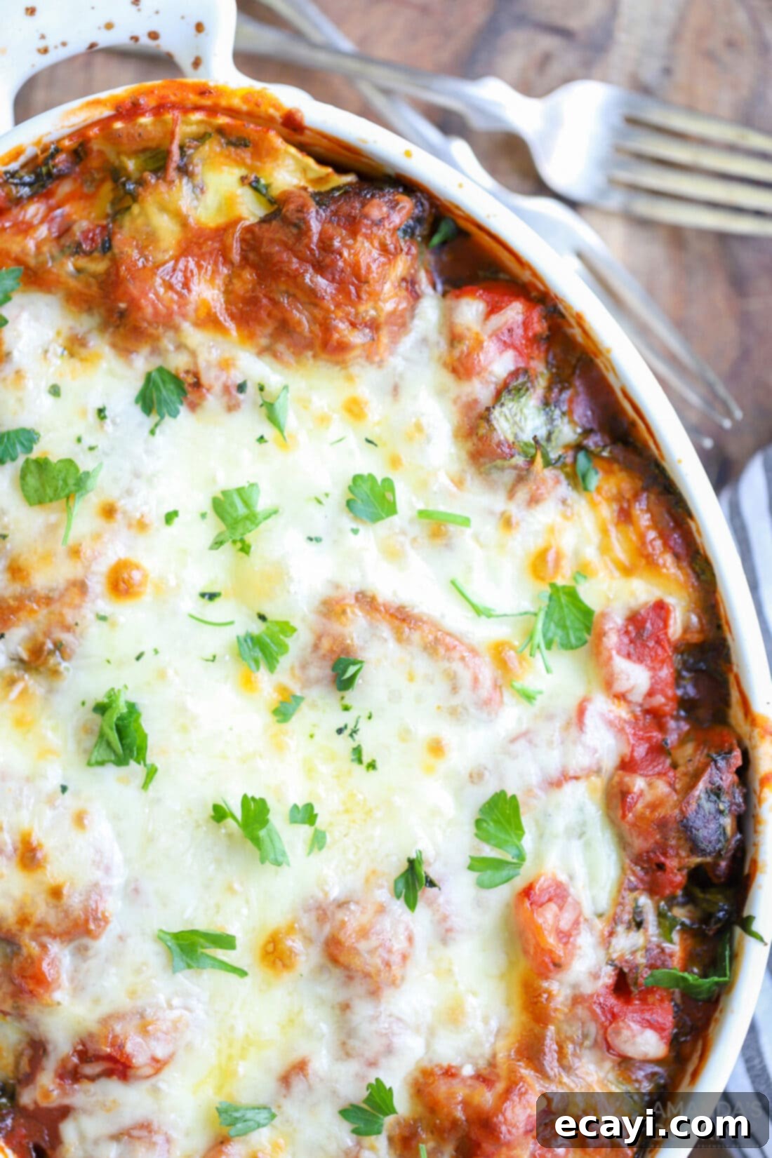Ravioli Lasagna Casserole 3 Another mouthwatering image of the ravioli lasagna casserole, emphasizing its bubbly, cheesy top and rich layers, perfect for a cozy dinner.