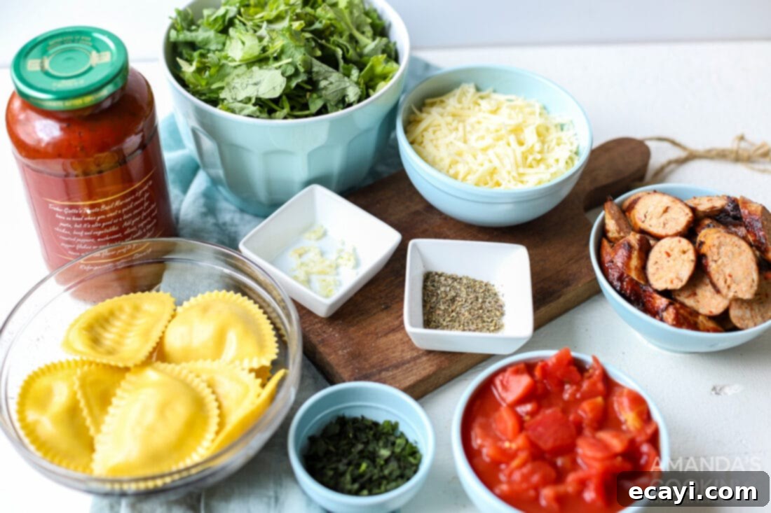 Ravioli Lasagna Casserole 4 A flat lay image displaying all the fresh and packaged ingredients laid out for making Ravioli Lasagna, including ravioli, marinara, sausage, spinach, and cheese.