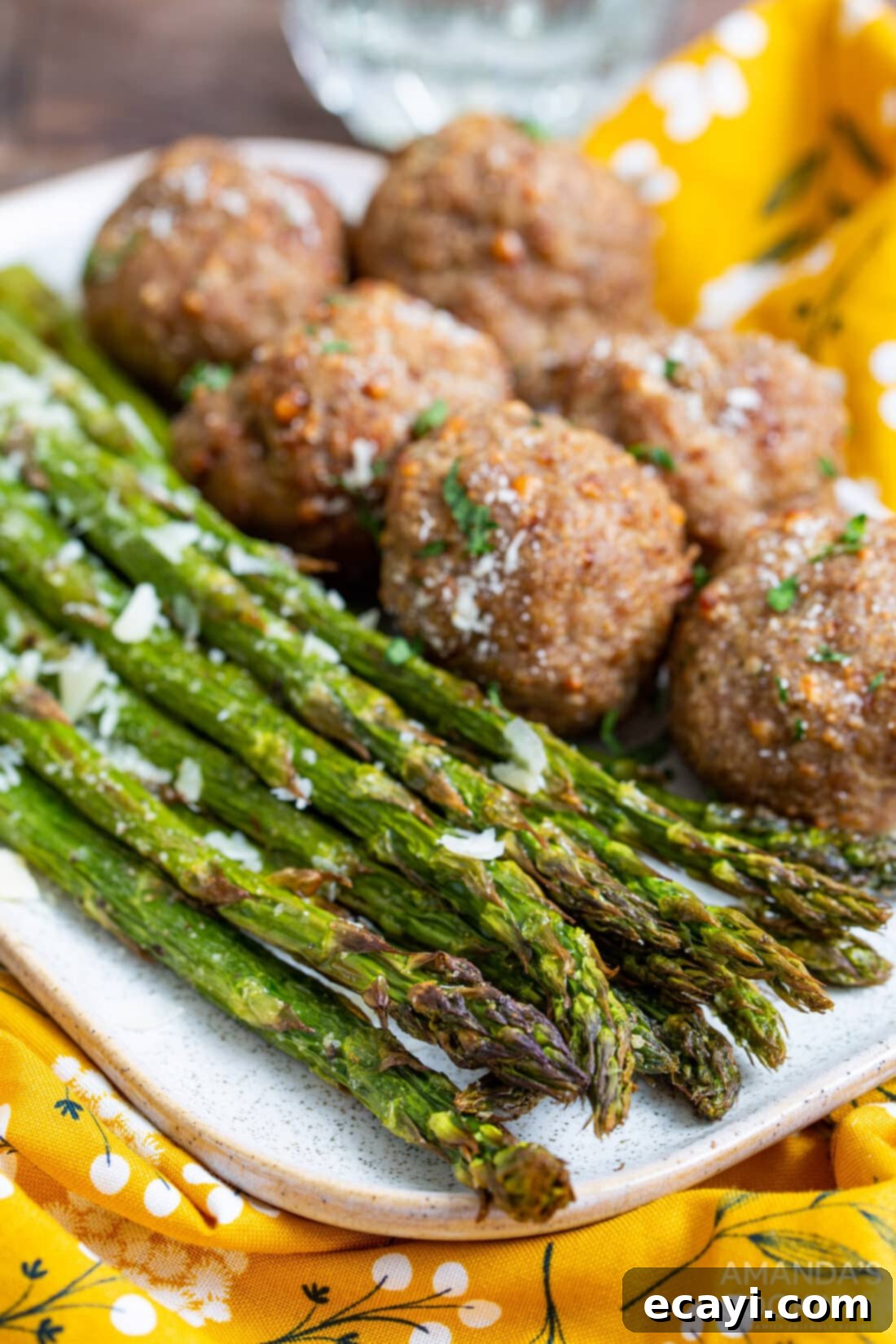 Crispy Air-Fried Asparagus 3 Air Fryer Asparagus served alongside homemade meatballs for a complete meal
