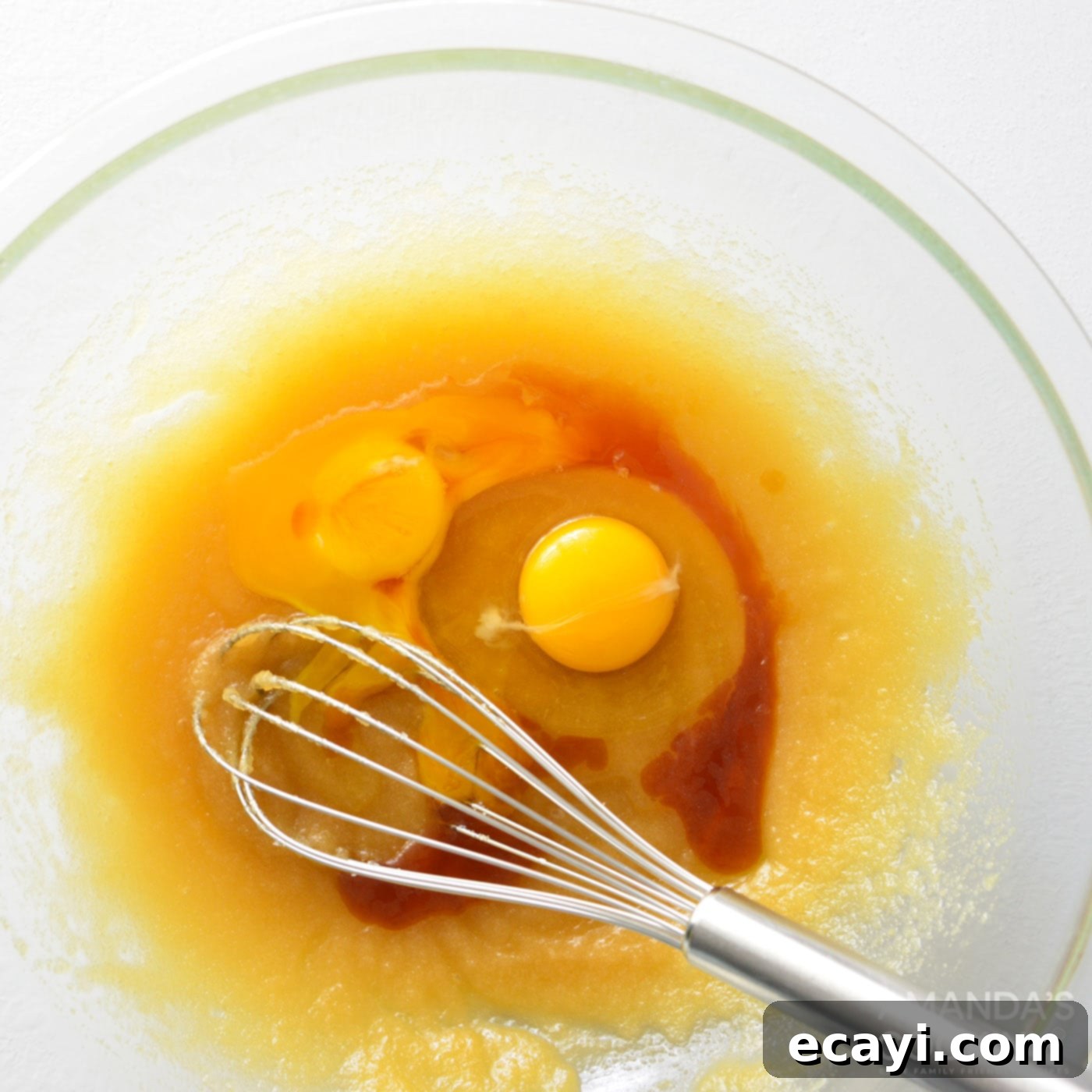 Decadent Carrot Cake Cookie Sandwiches 5 whisking wet ingredients into dry ingredients in a bowl