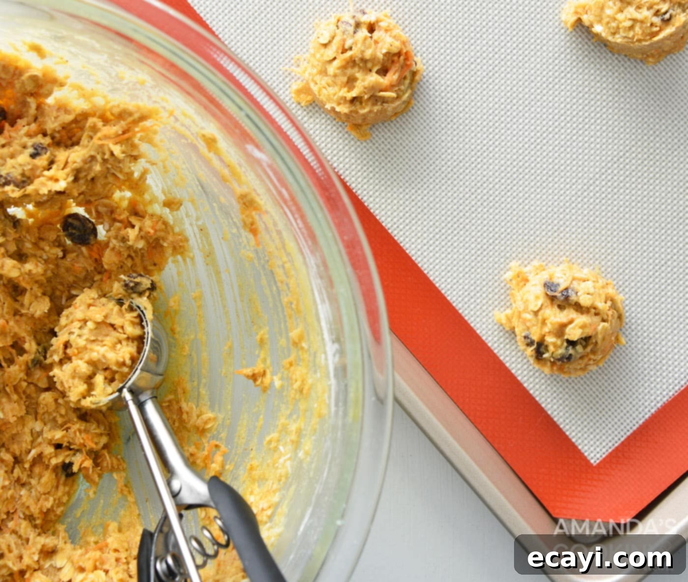 Decadent Carrot Cake Cookie Sandwiches 9 using a cookie scoop to scoop dough into balls on a baking sheet
