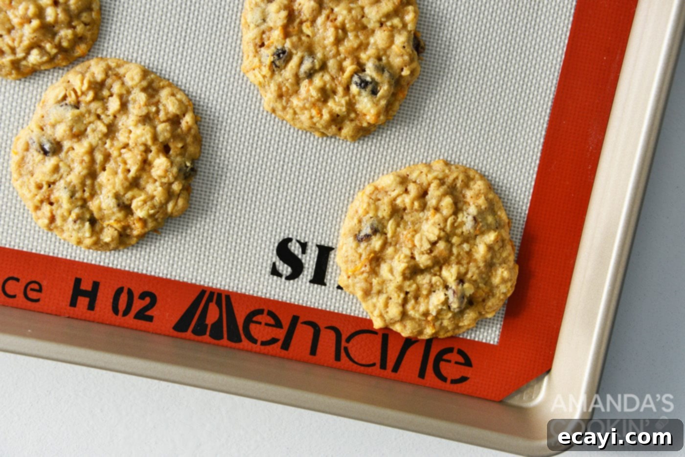 Decadent Carrot Cake Cookie Sandwiches 10 baked carrot cake cookies on a tray