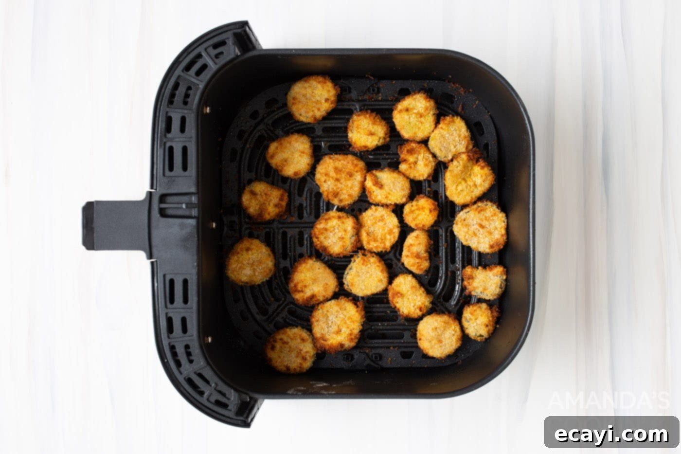 Crispy Air-Fried Pickles 7 gold brown fried pickles in the air fryer