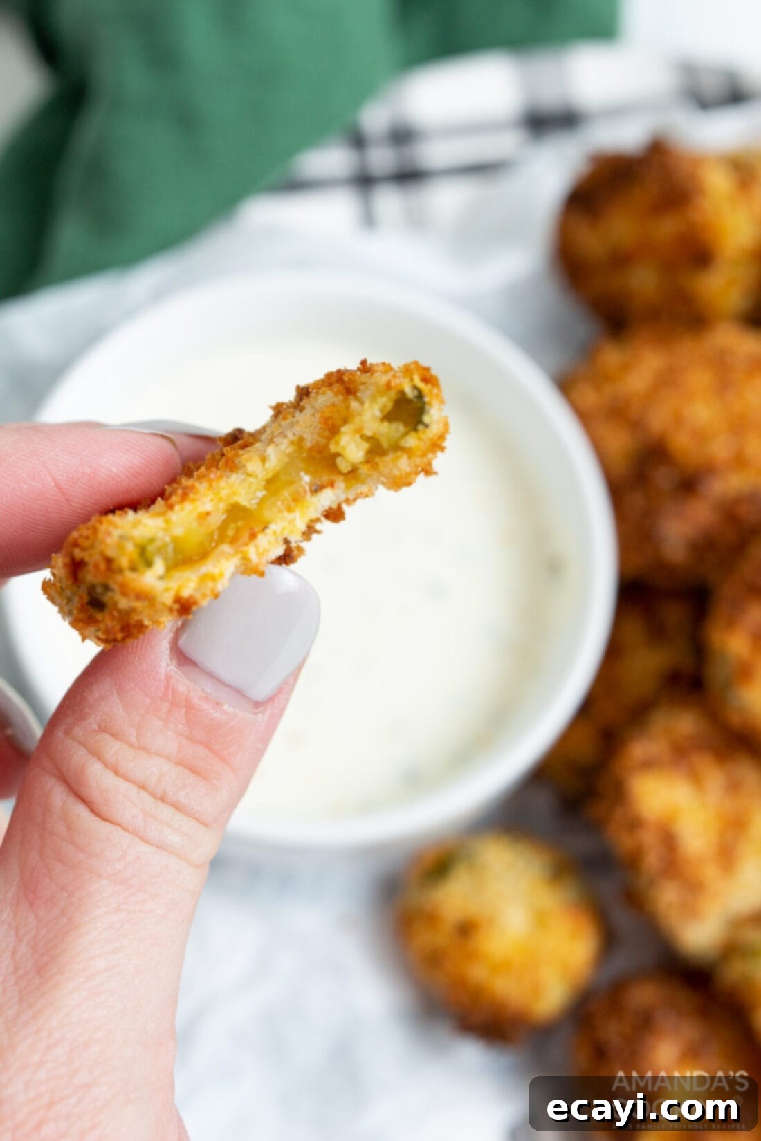 Crispy Air-Fried Pickles 8 air fryer fried pickle with a bite out of it