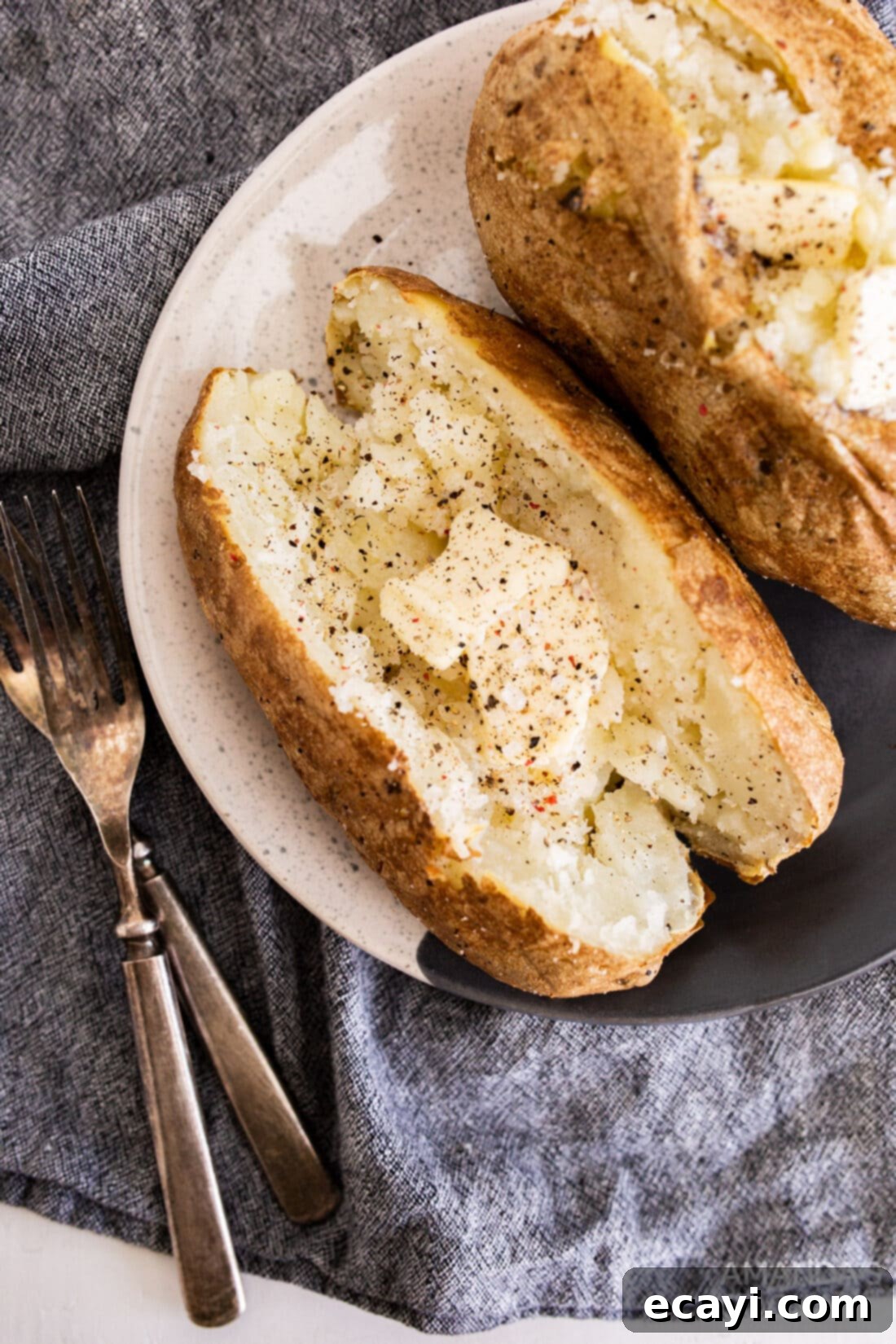 Perfect Air Fryer Baked Potatoes 3 air fried baked potato with butter