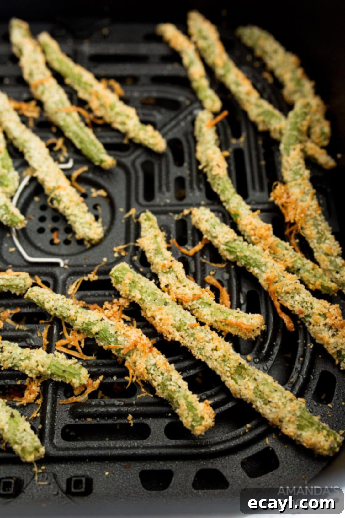 Crispy Air-Fried Green Bean Sticks 3 Air Fryer Green Bean Fries in an air fryer basket