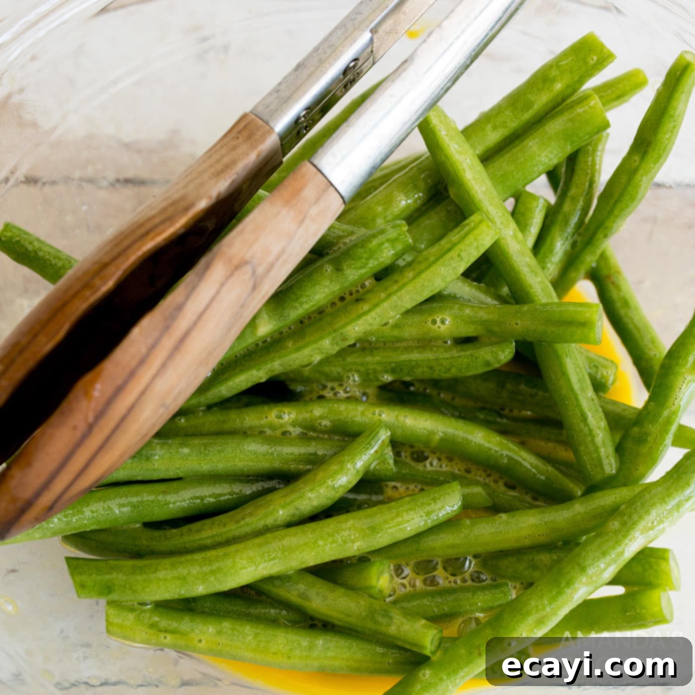 Crispy Air-Fried Green Bean Sticks 5 tossing green beans in a bowl of eggs
