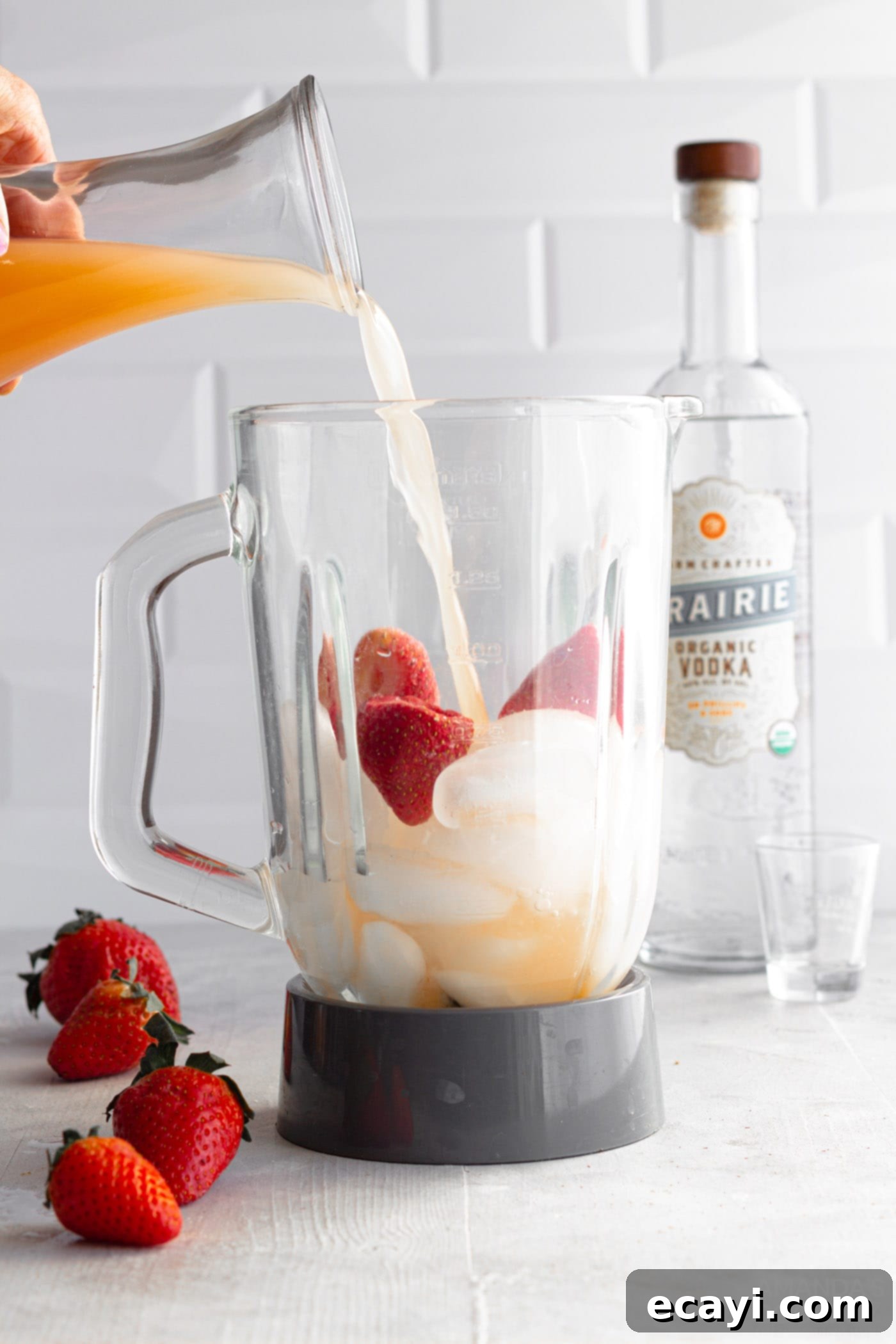 Strawberry Salty Freeze 6 Strawberries, ice, grapefruit juice, and vodka inside a blender, ready to be mixed for Frozen Strawberry Salty Dog