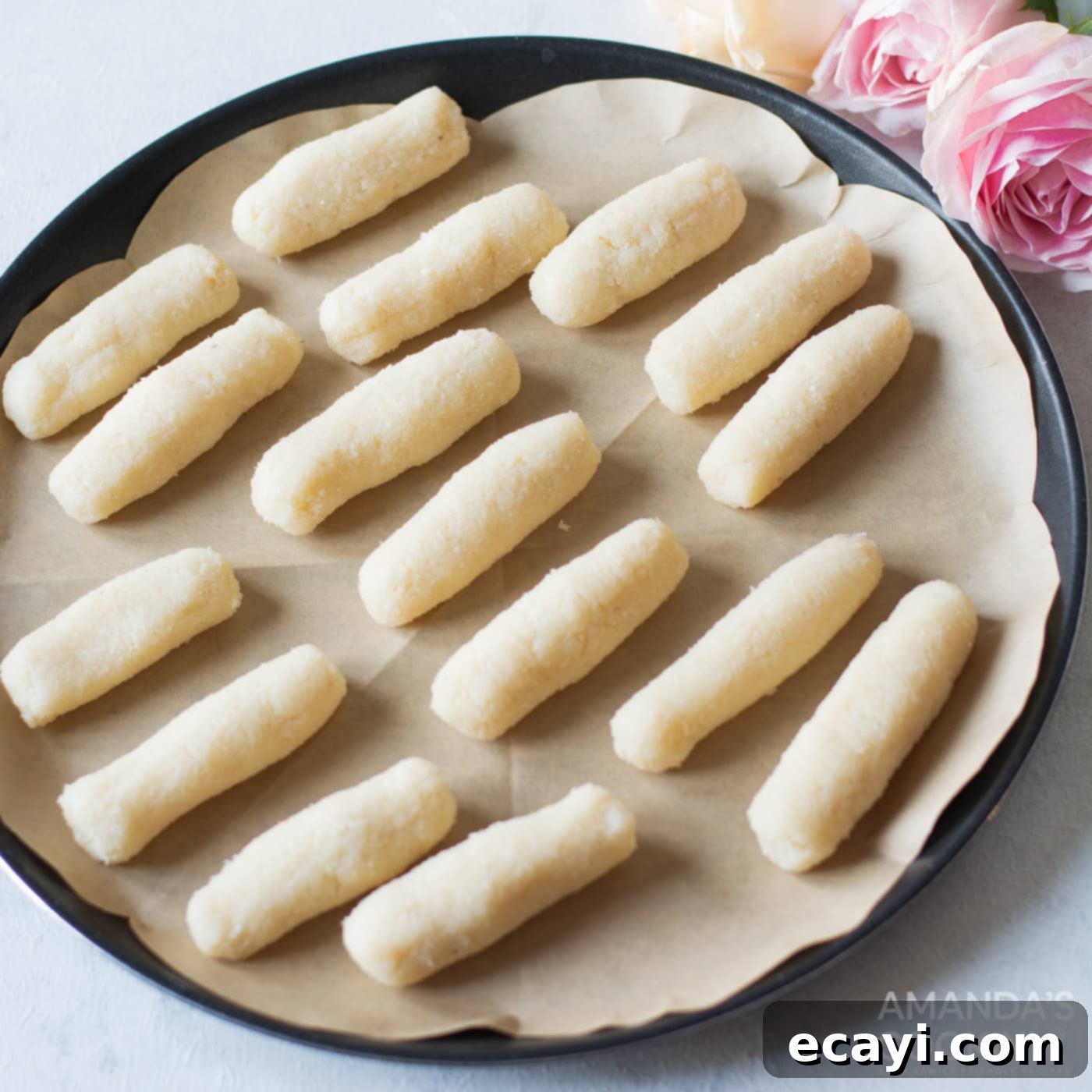 Copycat Bounty Bars 7 rolled coconut filling on parchment paper
