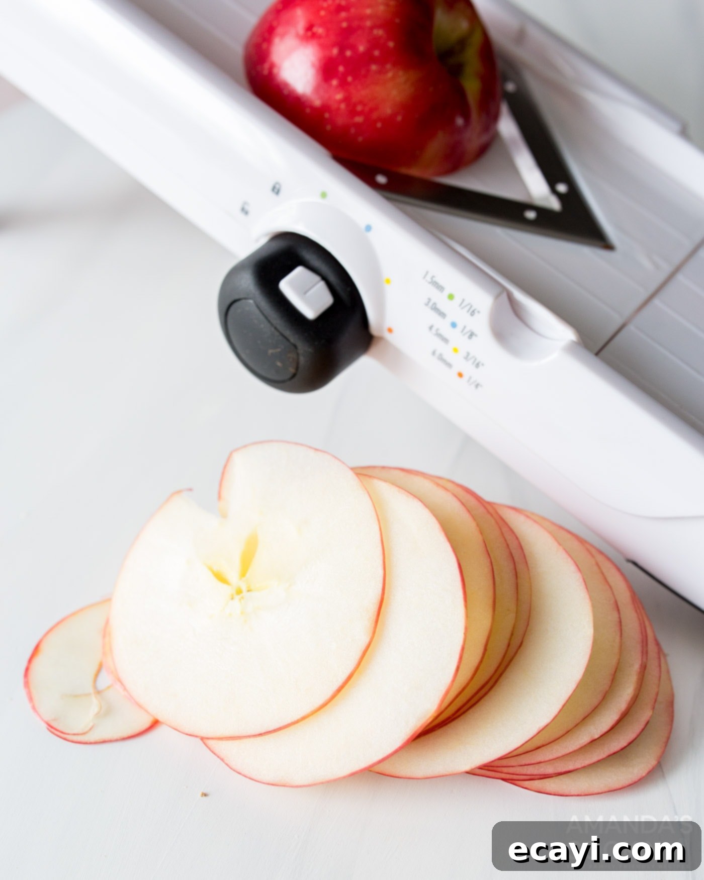 Crispy Air-Fried Apple Slices 5 sliced apples next to a mandolin