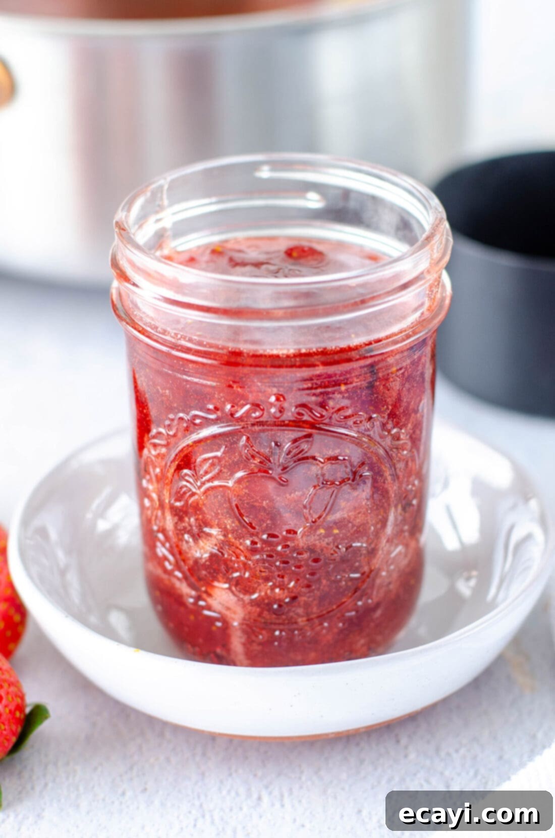 Homemade Strawberry Bliss 4 Close-up of a jar of homemade strawberry jam, ready to be enjoyed