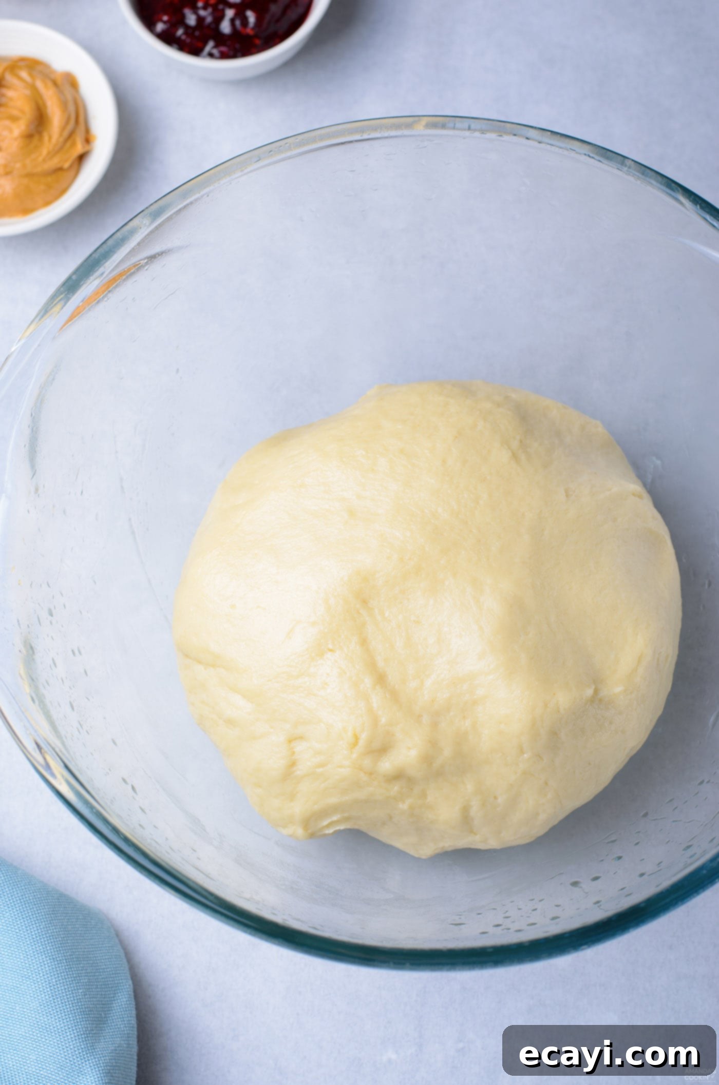 Peanut Butter and Jelly Donut Perfection 7 Donut dough ball resting in a lightly greased bowl, covered for first proofing
