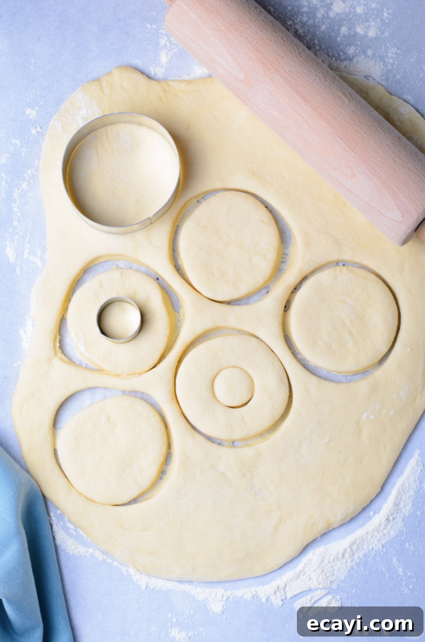 Peanut Butter and Jelly Donut Perfection 9 Using a donut cutter to cut out round donut shapes from rolled dough