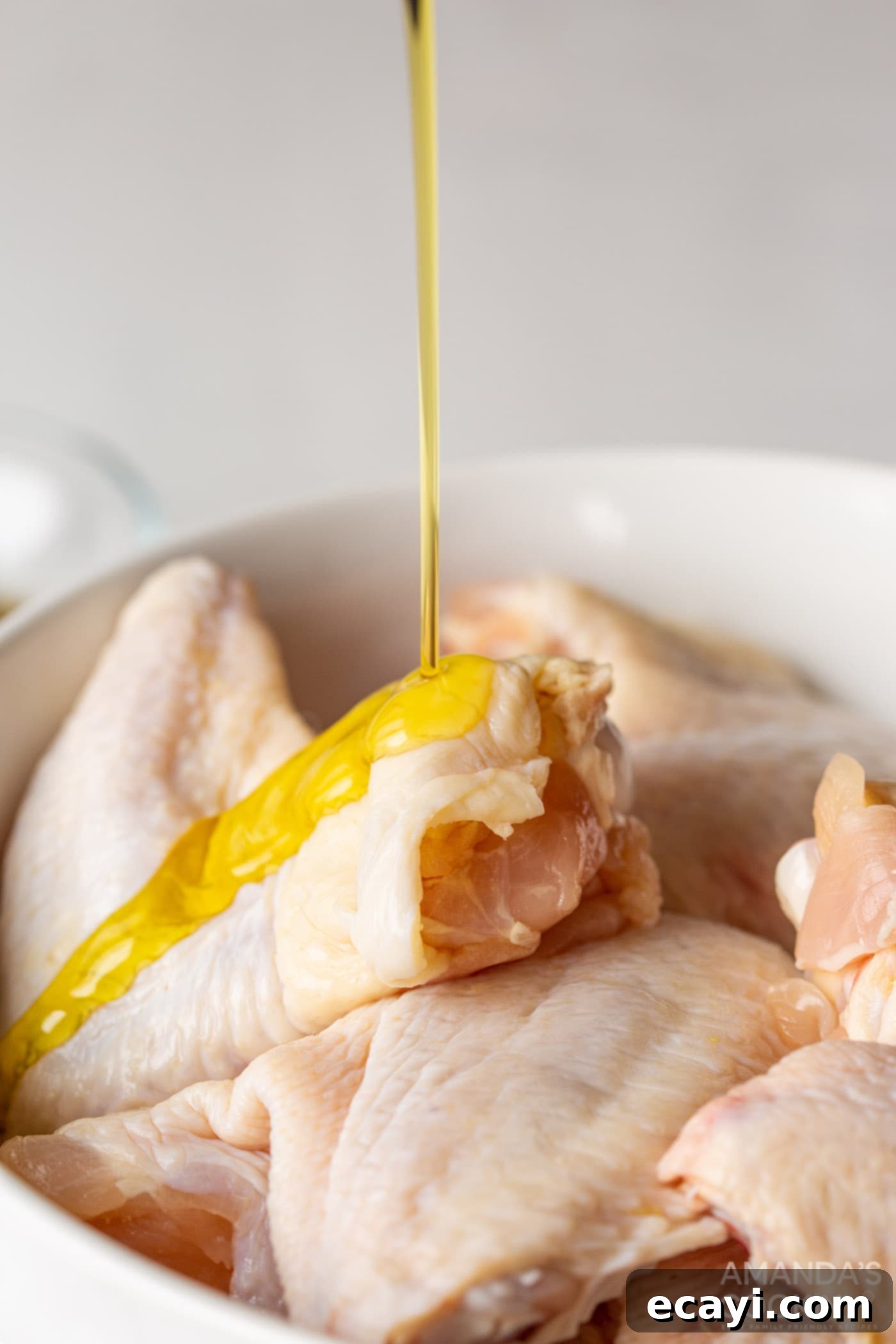 Crispy Air-Fried Wings 5 olive oil pour on chicken wings