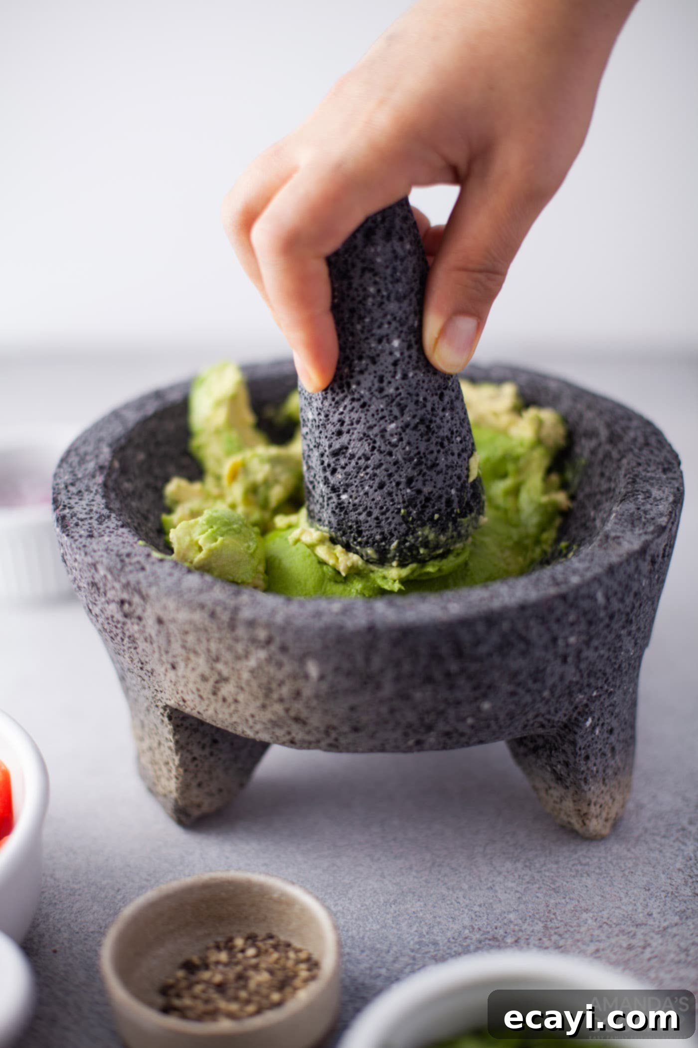 Guacamole 5 smashing avocado