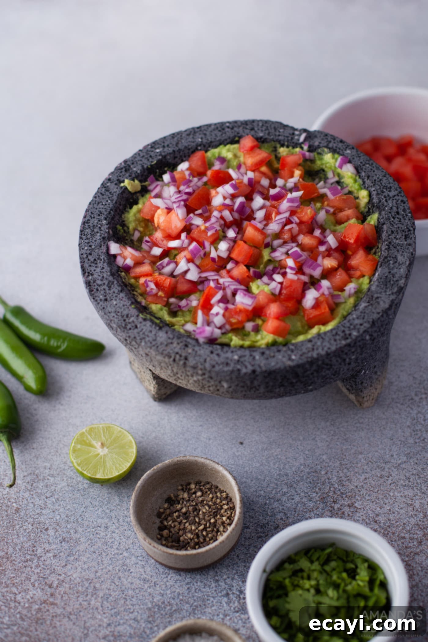 Guacamole 6 onion, tomato, and cilantro in avocado mixture