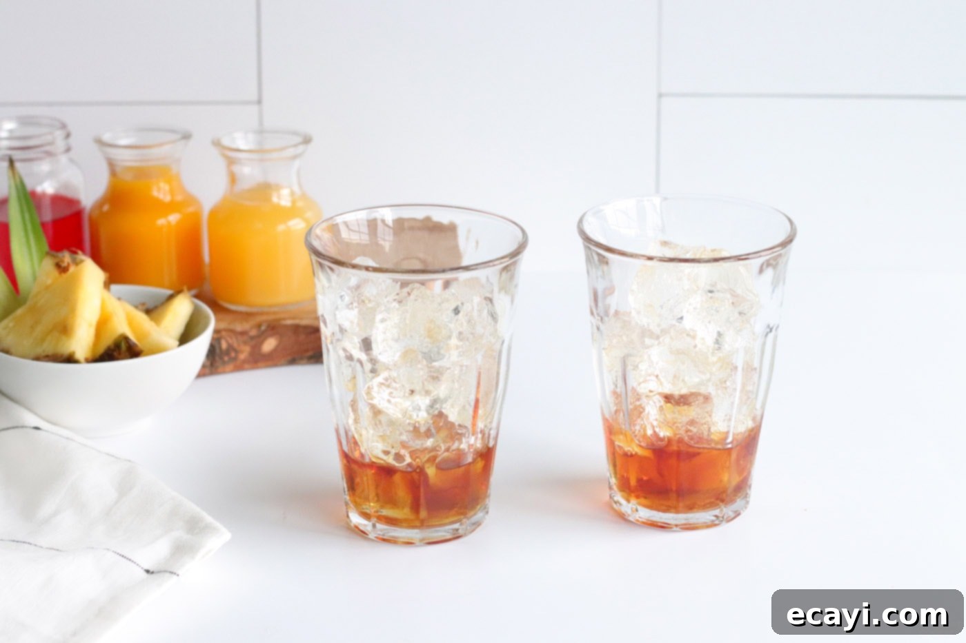 Azure Aloha Mai 5 dark rum in a glass of ice, ready for the next ingredients of the Blue Hawaiian Mai Tai.