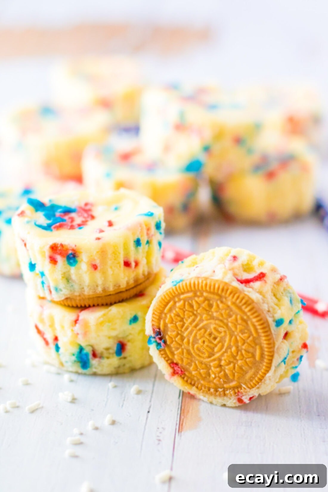 Stars and Stripes Cheesecake Bites 3 A stack of two Patriotic Mini Cheesecakes, with more arranged behind, highlighting their bite-sized appeal.