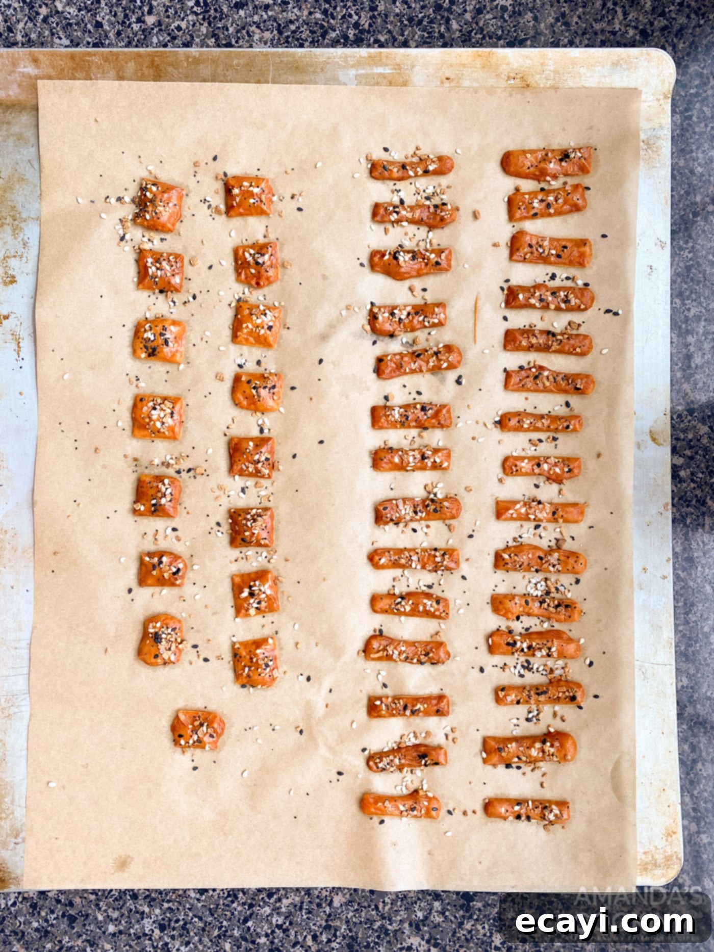 Crunchy Keto Cheese Bites 7 A baking sheet filled with golden, crispy baked cheese crackers, freshly removed from the oven and cooling.