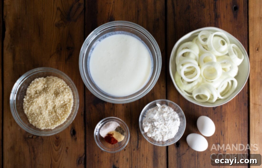 Golden Air Fryer Onion Rings 4 Ingredients for Air Fryer Onion Rings laid out on a table
