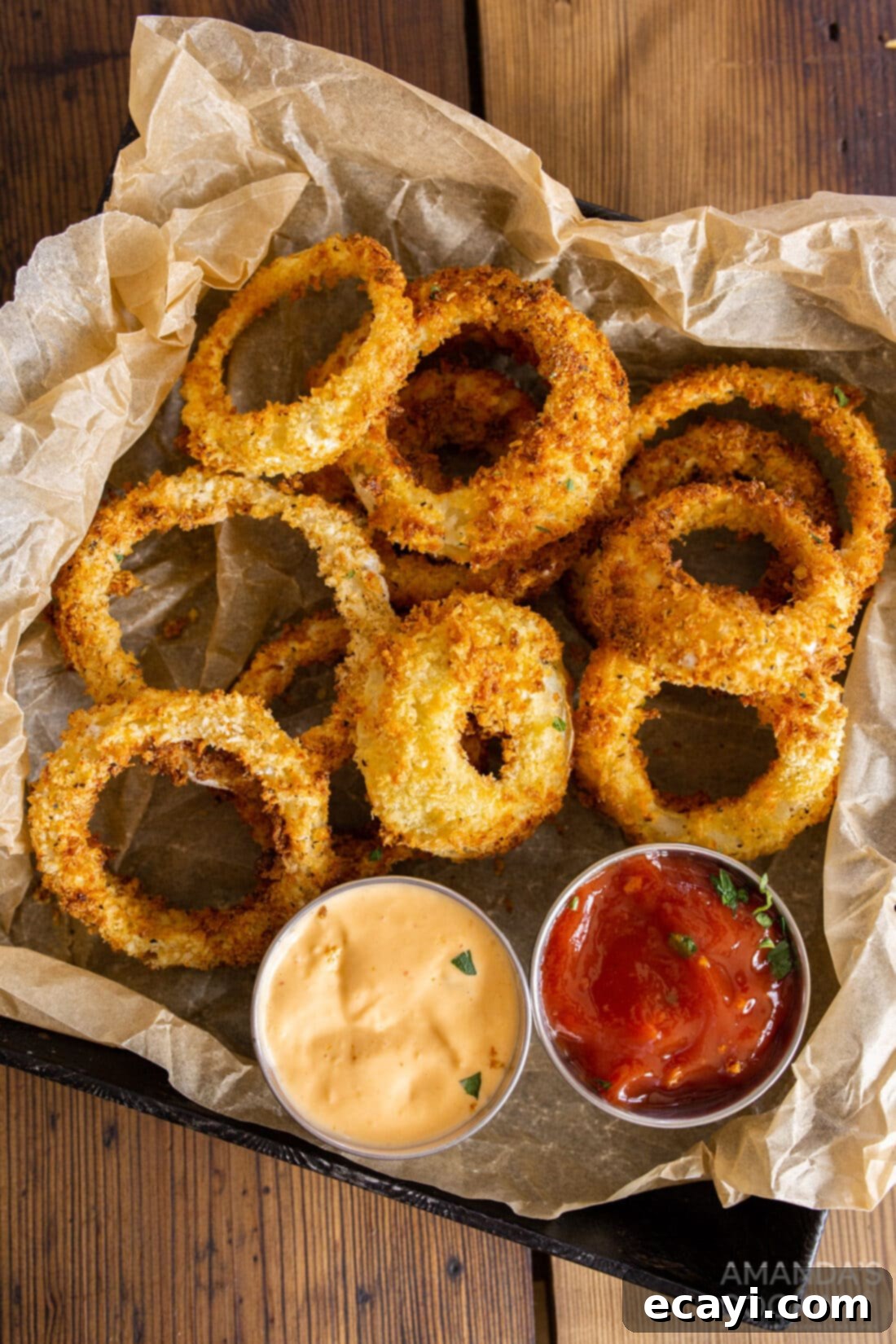 Golden Air Fryer Onion Rings 9 Crispy Air Fryer Onion Rings served on a tray with parchment paper