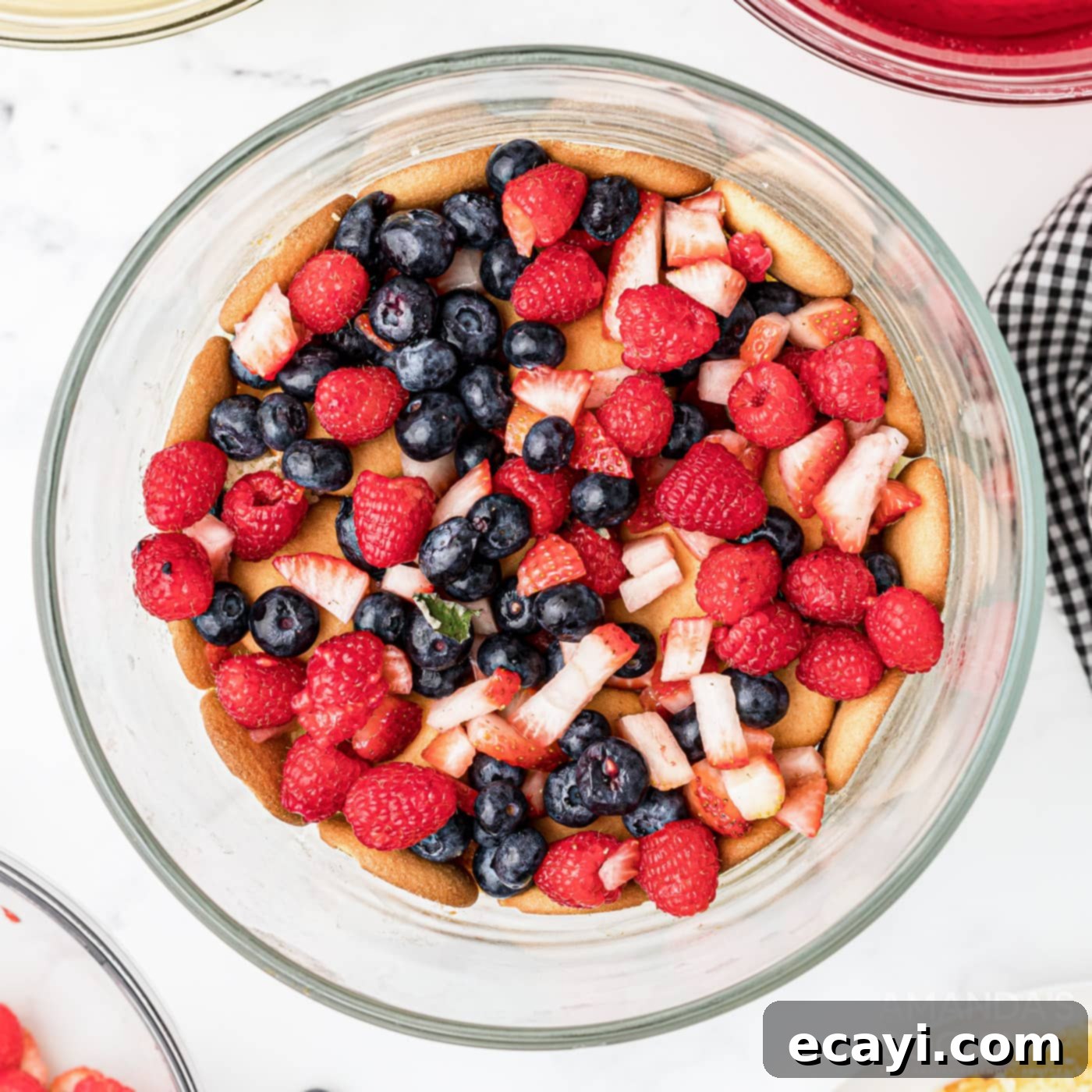 Whimsical Jelly Parfait 8 chopped fresh fruit layered over wafers and cake in trifle bowl