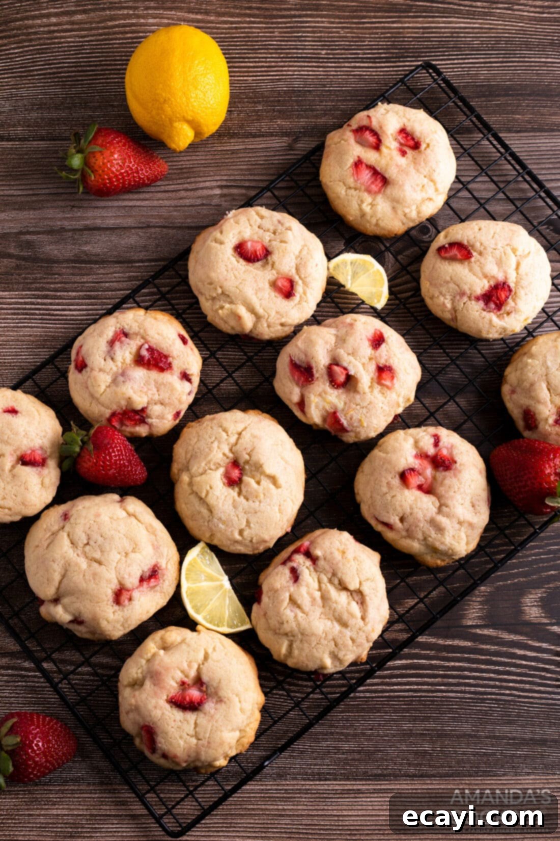 Zesty Strawberry Lemonade Cookies 2 Freshly baked strawberry lemonade cookies cooling on a wire rack, showcasing their golden edges and soft centers.