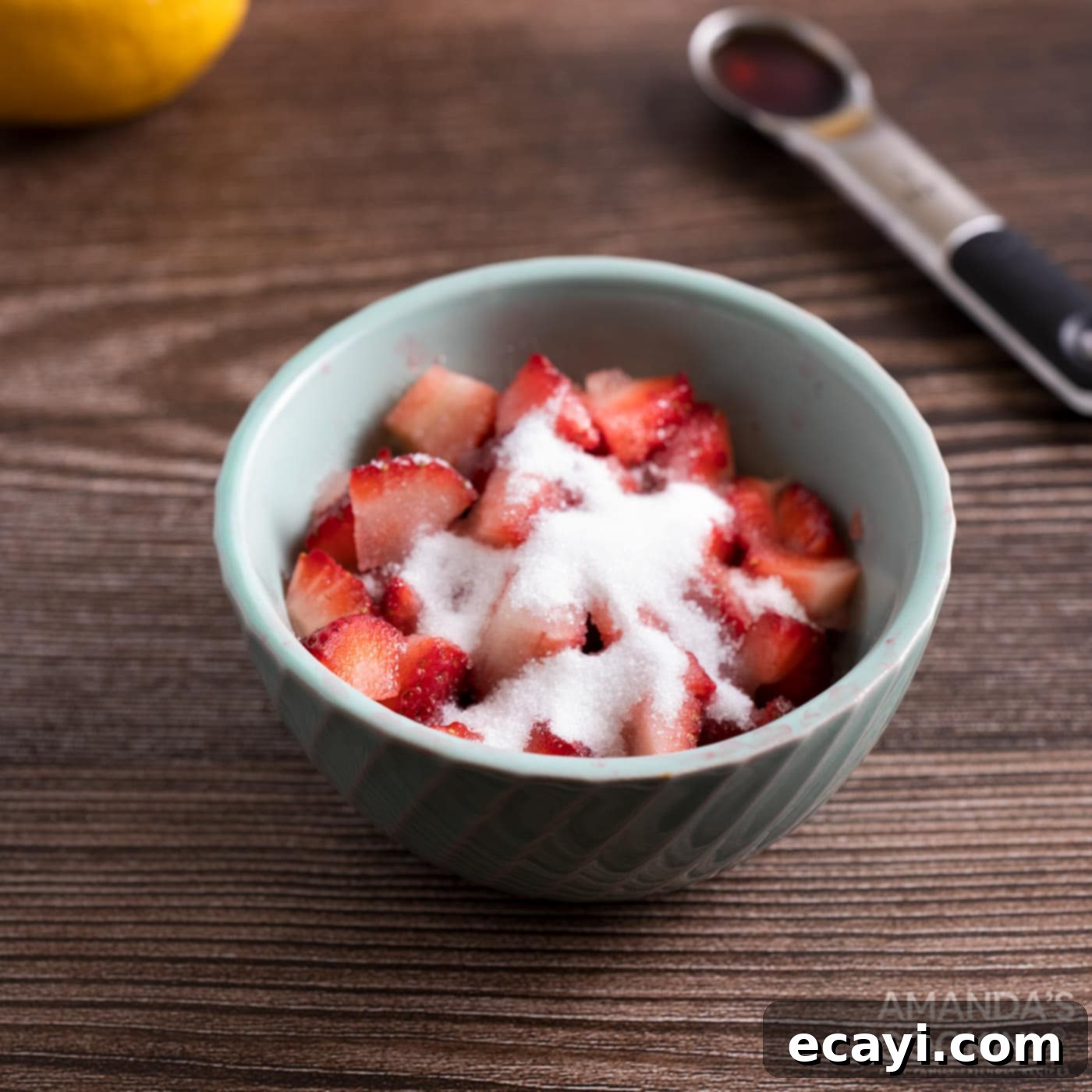 Zesty Strawberry Lemonade Cookies 5 Chopped strawberries mixed with lemon juice and sugar in a bowl, macerating before being added to cookie dough.