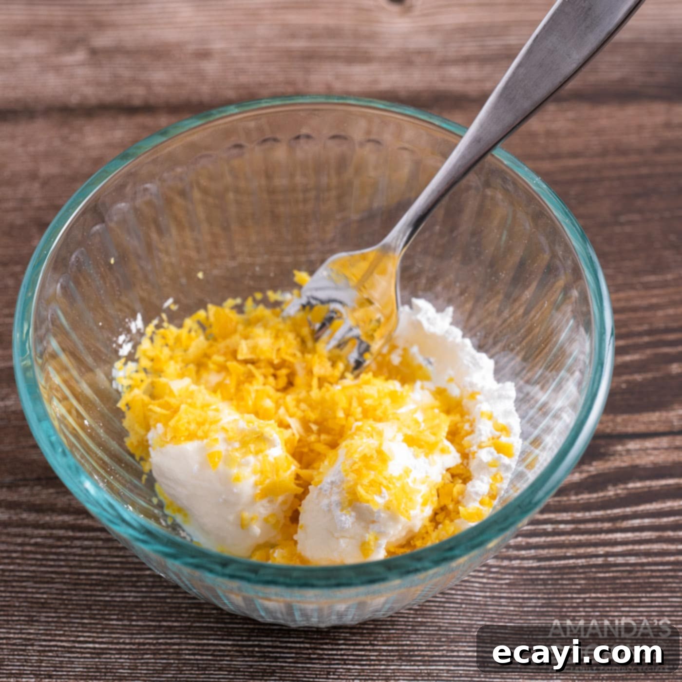 Zesty Strawberry Lemonade Cookies 8 Softened cream cheese, powdered sugar, and lemon zest mixed together in a bowl, ready for scooping.