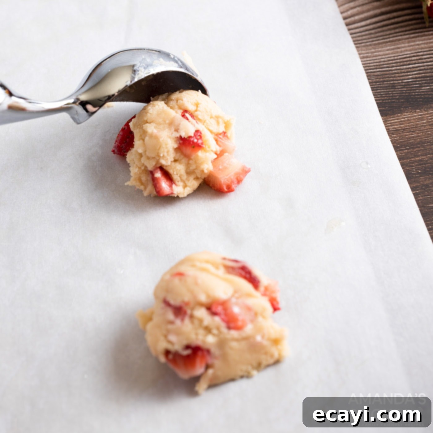 Zesty Strawberry Lemonade Cookies 10 Using a cookie scoop to portion cookie dough onto a baking sheet.