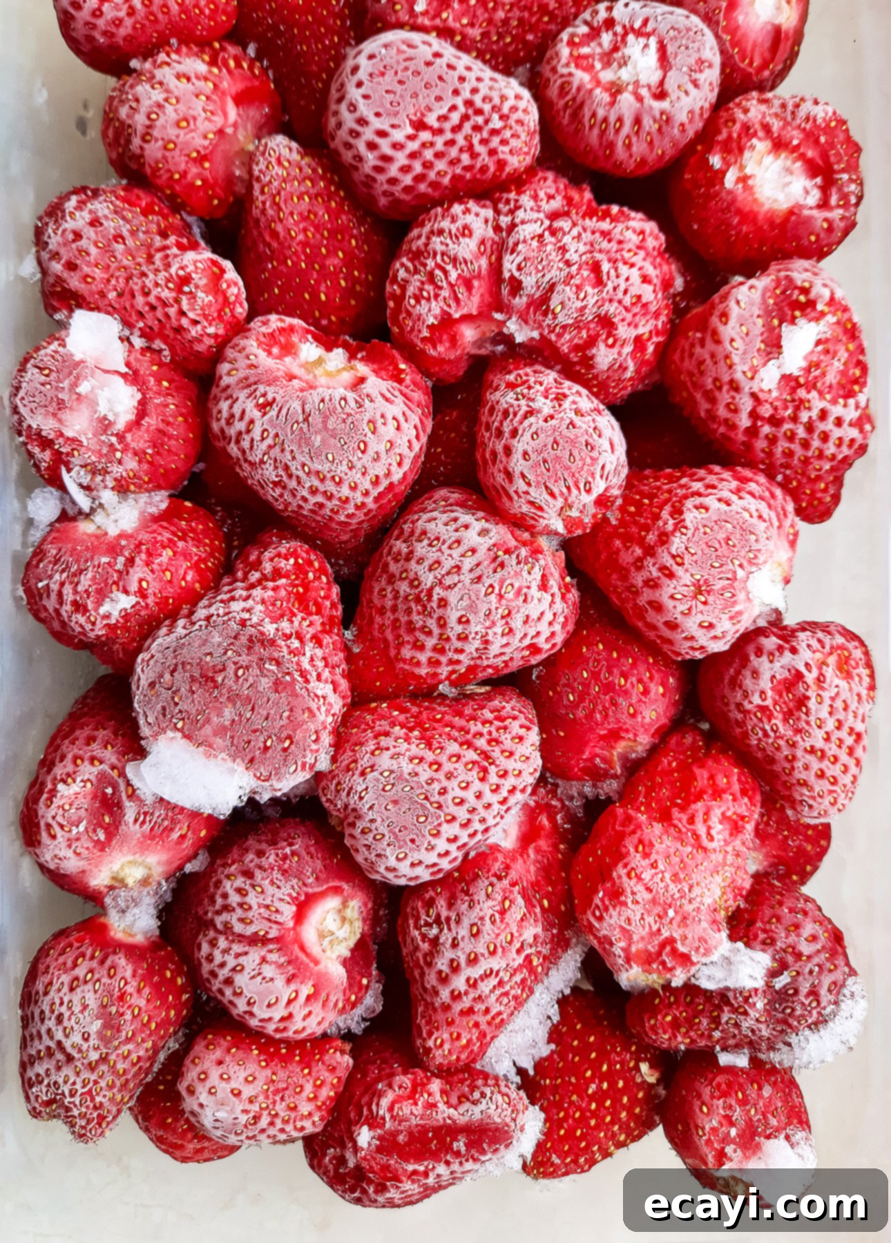 Luscious Strawberry Rhubarb Pudding Cakes 6 Frozen strawberries in a plastic container // FoodNouveau.com