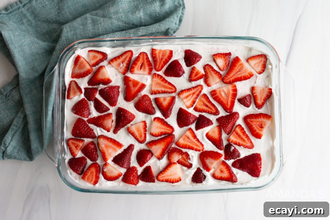 Strawberry Dream Layers 13 sliced strawberries on top of dessert in a baking dish
