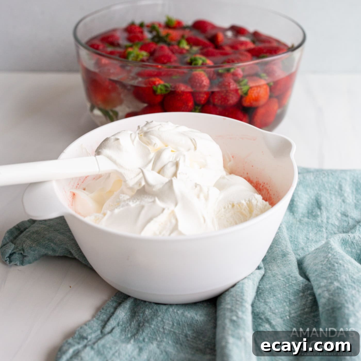 Strawberry Dream Layers 10 folding cool whip into strawberry jello mixture