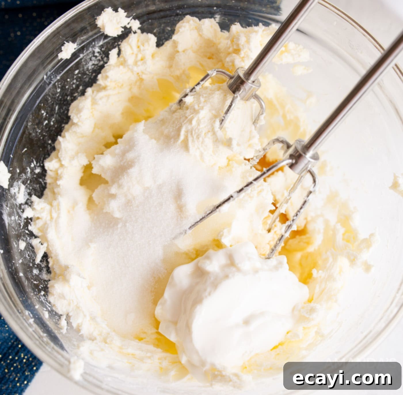 Bite-Sized Cheesecake Delights 7 beating cheesecake ingredients with a hand mixer