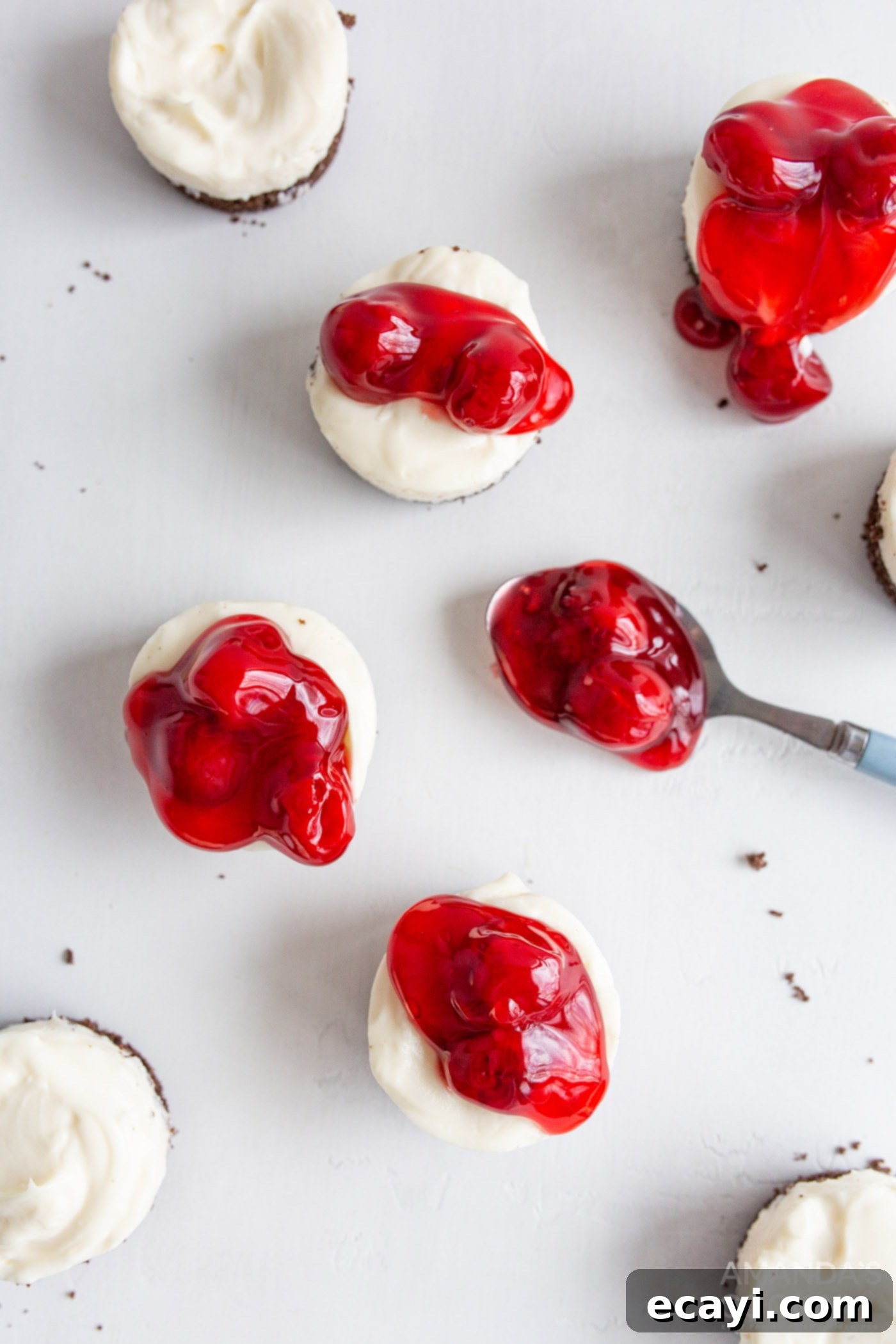 Bite-Sized Cheesecake Delights 9 topping mini cheesecakes with cherry pie filling
