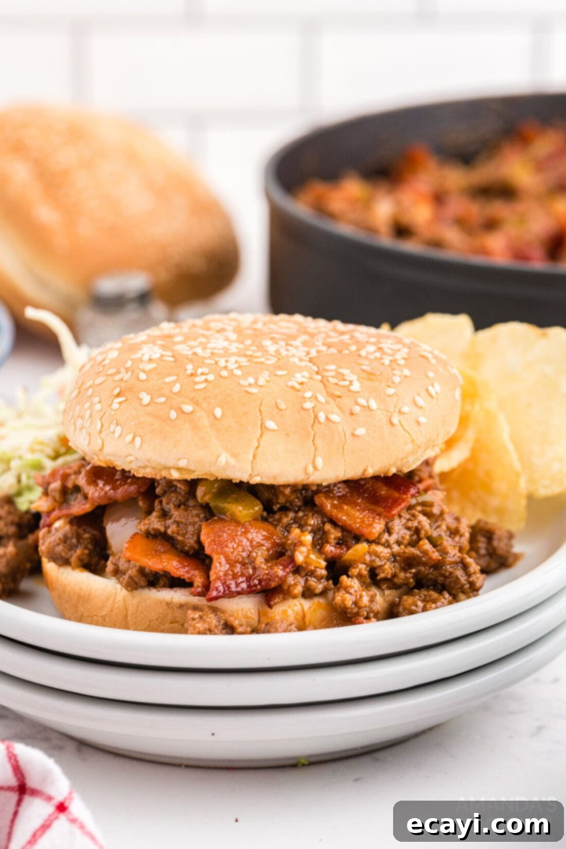 Smoky Bacon Sloppy Joes 2 Bacon Sloppy Joes on a bun, ready to be enjoyed