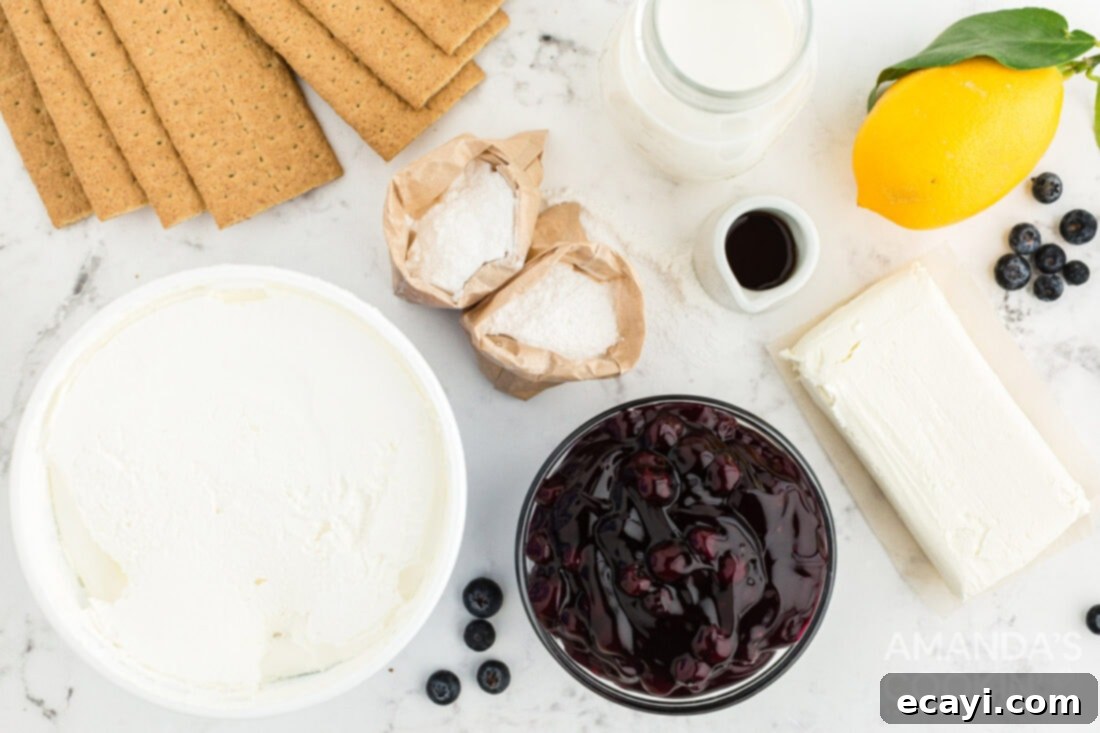 Zesty Lemon Blueberry Cloud Cake 4 Arrangement of ingredients for Lemon Blueberry Icebox Cake: cream cheese, lemon pudding boxes, Cool Whip, lemon, vanilla, milk, graham crackers, and blueberry pie filling.