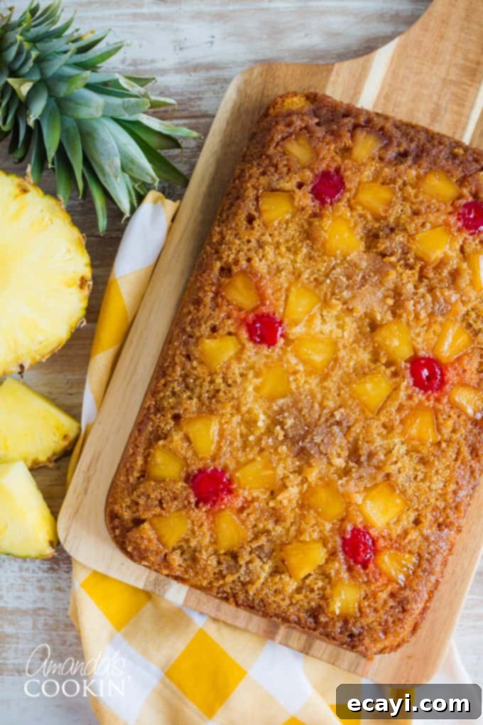 This homemade pineapple upside down cake is crafted with a moist yellow cake, topped with a buttery brown sugar pineapple and cherry layer. Perfect for holidays or any special day. #pineappleupsidedowncake #dessertrecipe #easycake #homemadedessert #thanksgivingdesserts #eastercake Classic Pineapple Upside Down Cake with Cherries