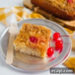 Golden Pineapple Indulgence 2 A beautifully presented slice of homemade Pineapple Upside Down Cake on a plate.